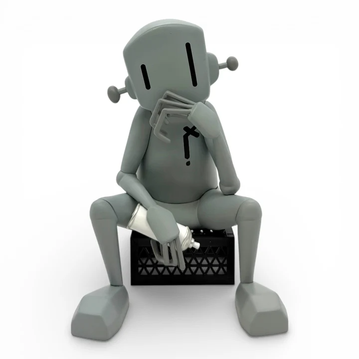 The Thinker vinyl figure seated on a black crate, front view